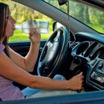 Woman drinking alcohol while driving: LawteryX Traffic, DUI/DWI Blog
