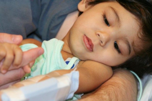 injured child held by an adult