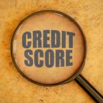 magnifying glass focused on credit score
