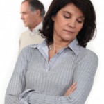 Upset woman with partner behind: Lawtery X Divorce/Family Law Blog