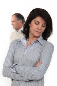 Upset woman with partner behind: Lawtery X Divorce/Family Law Blog