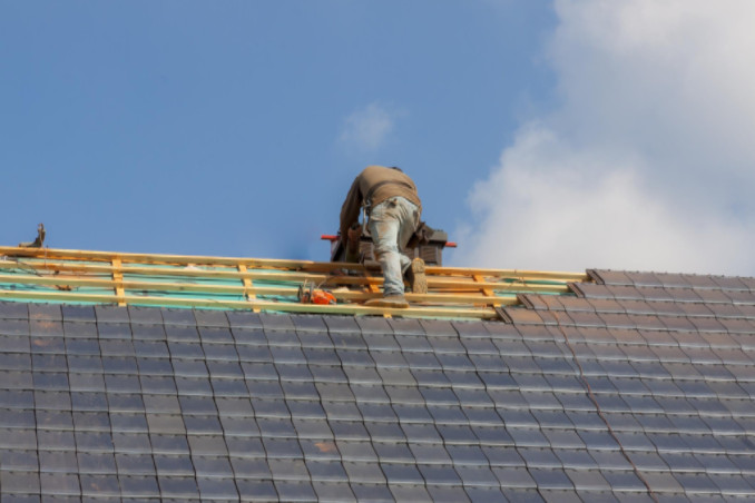 Worker conducting work on roof