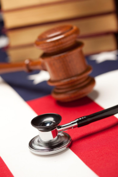 Gavel and stethoscope on American flag: LawteryX Defective Drugs and Medical Malpractice Blog