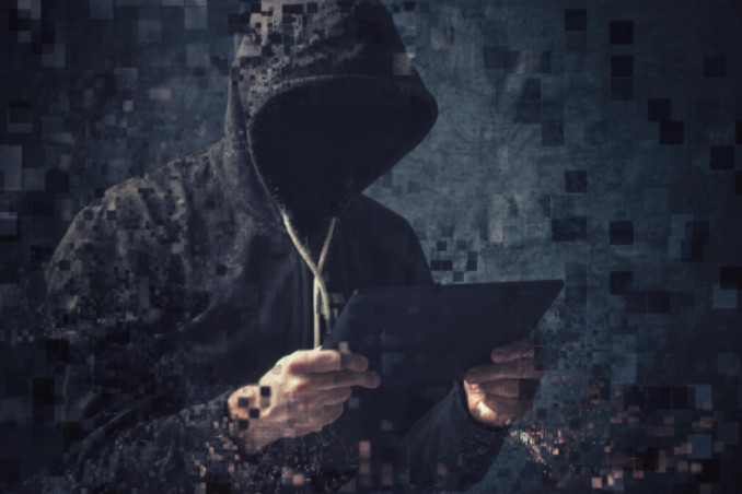 Pixilated hooded man using tablet: LawteryX Criminal Law Blog