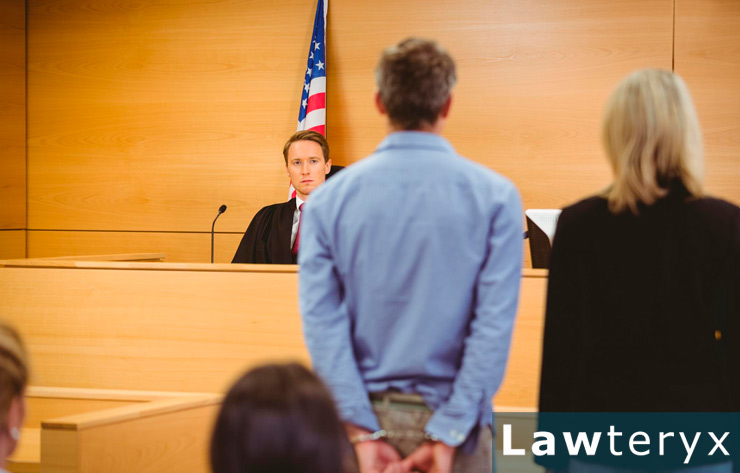 man standing in courtroom to take a plea deal